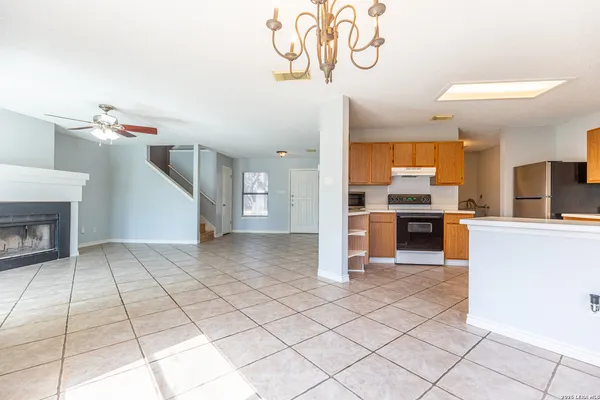a view of kitchen with microwave and cabinets