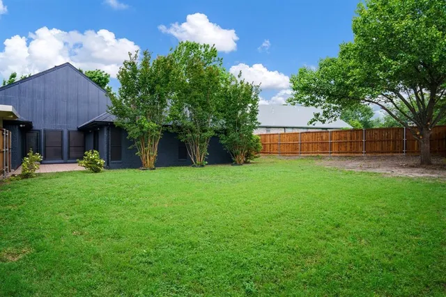 a view of backyard with green space