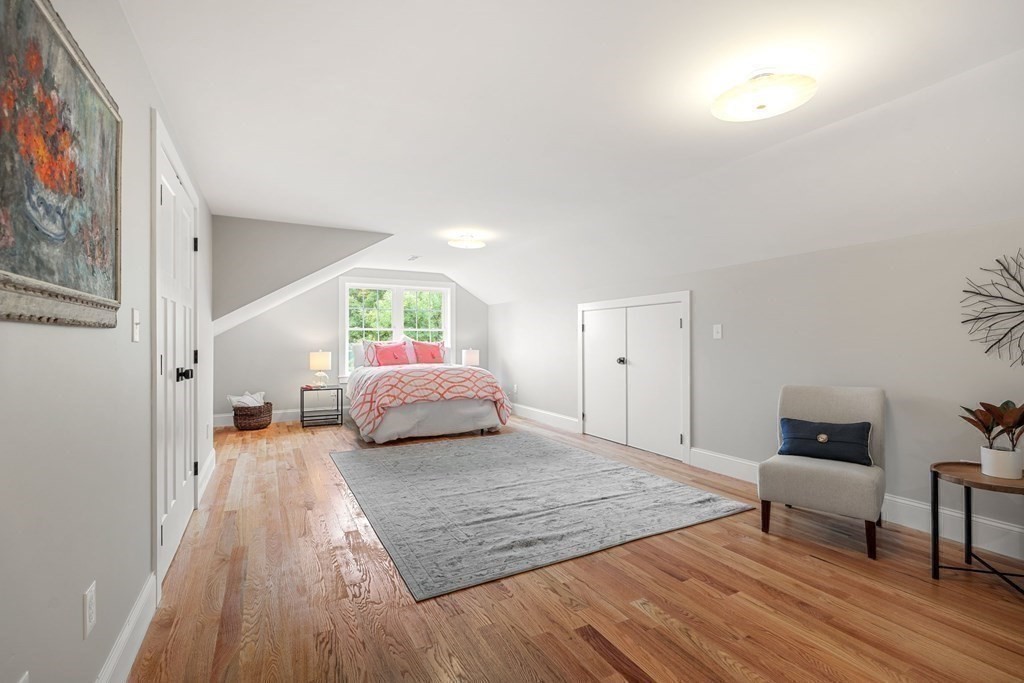 32 Johnson Road, Unit 32 Arlington, MA 02474 - Photo 15 of 34 a bedroom with a bed and a couch