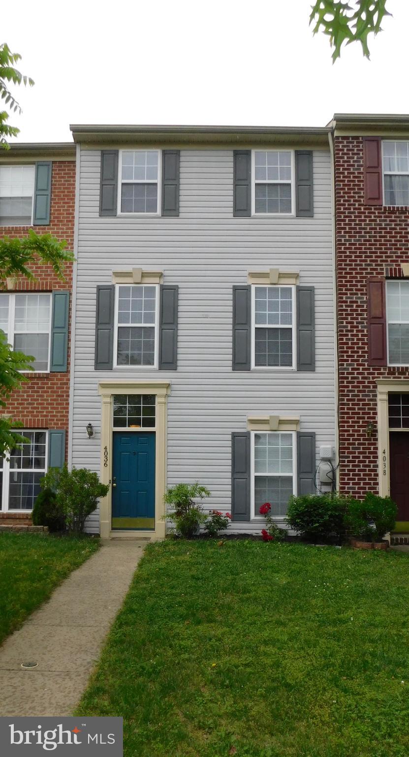 4036 Cutty Sark Road Baltimore, MD 21220 - Photo 1 of 25 a front view of a house with a yard