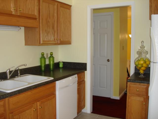278 Mountain Pass Road Blue Ridge, VA 24064 - Photo 10 of 19 a kitchen with granite countertop a sink stainless steel appliances a counter space and cabinets