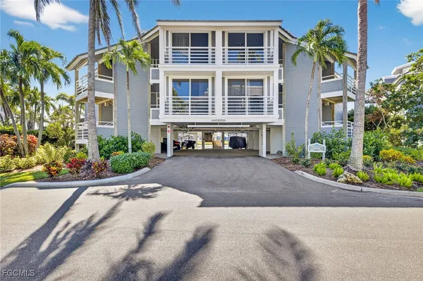 a front view of a house with a yard and a garage