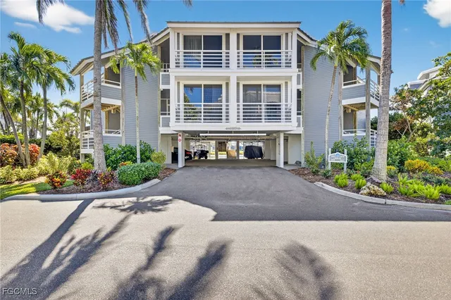 a front view of a house with a yard and a garage