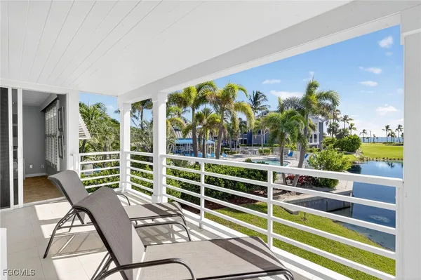a view of a chairs and table in a patio