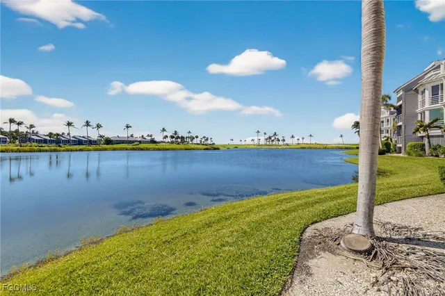 a view of a swimming pool and an outdoor seating