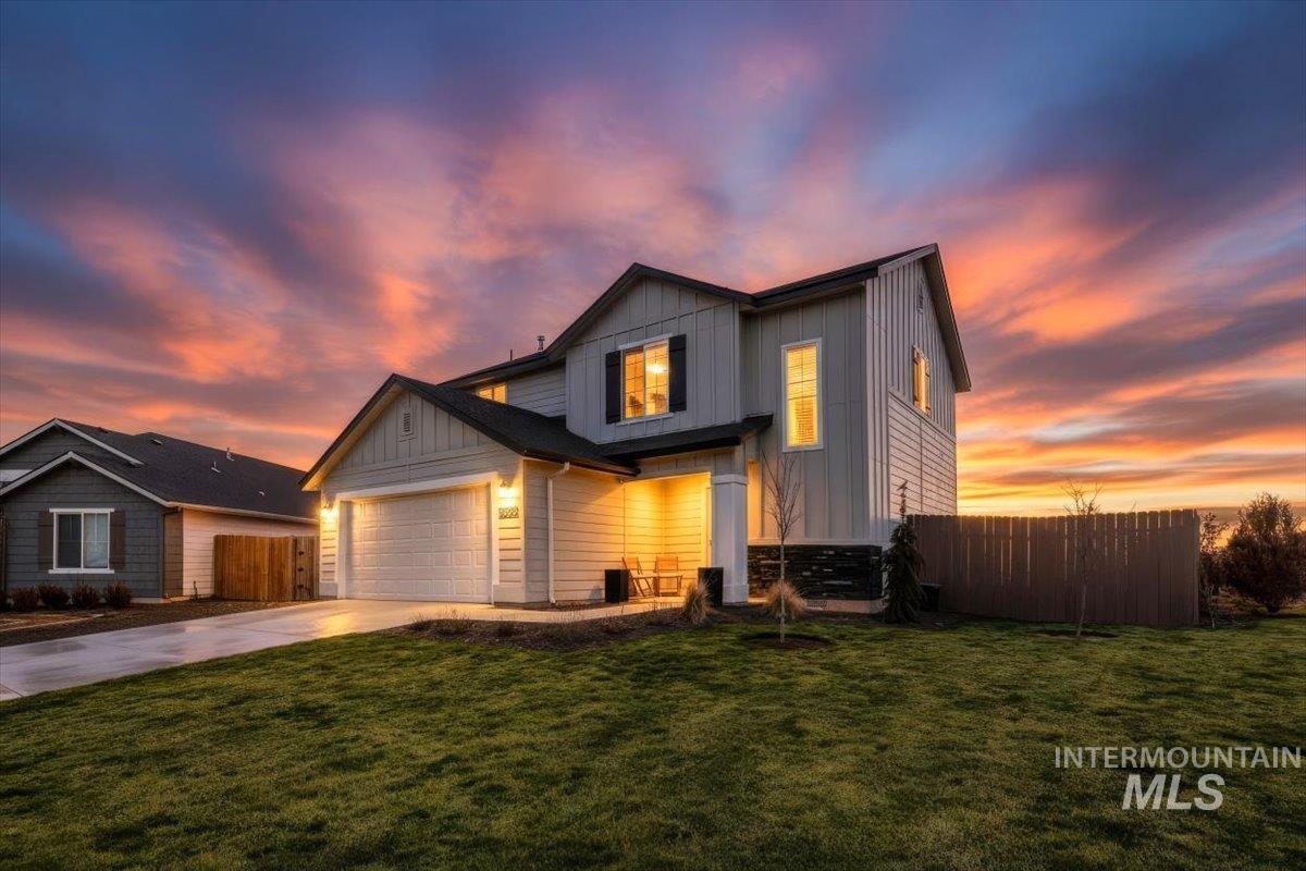 13520 Farwell Street Caldwell, ID 83607 - Photo 1 of 26 View of front of house featuring board and batten siding, driveway, and an attached garage