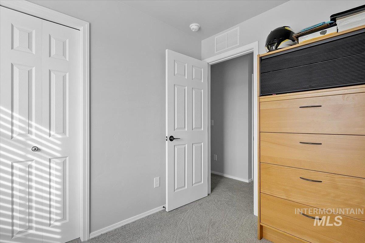 13520 Farwell Street Caldwell, ID 83607 - Photo 18 of 26 Unfurnished bedroom with light colored carpet and baseboards