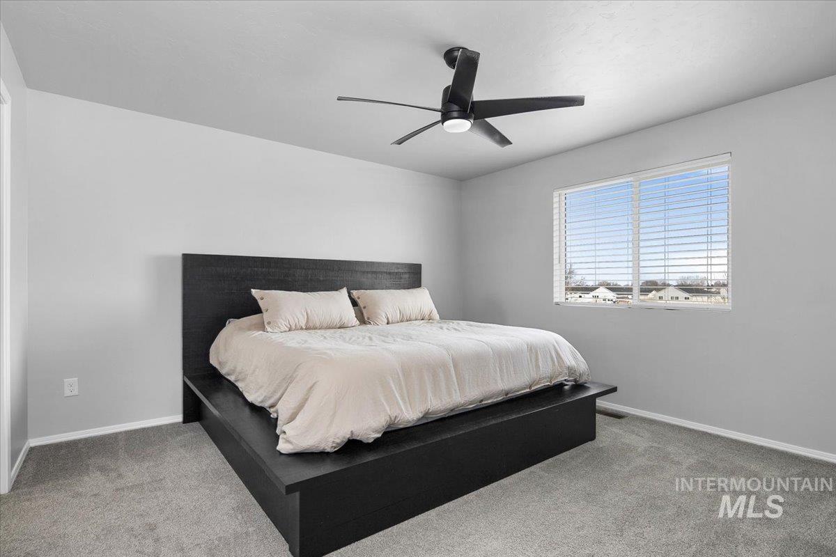 13520 Farwell Street Caldwell, ID 83607 - Photo 19 of 26 Bedroom featuring light carpet and a ceiling fan
