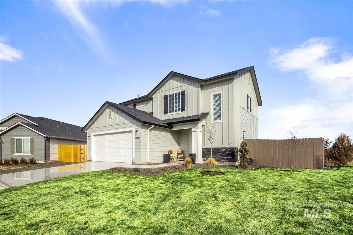13520 Farwell Street Caldwell, ID 83607 - Photo 2 of 26 View of front of house featuring board and batten siding, concrete driveway, and an attached garage