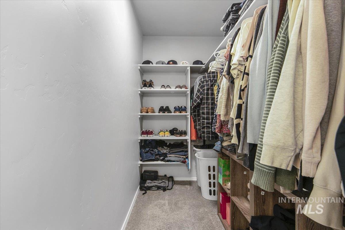 13520 Farwell Street Caldwell, ID 83607 - Photo 23 of 26 Walk in closet featuring light colored carpet