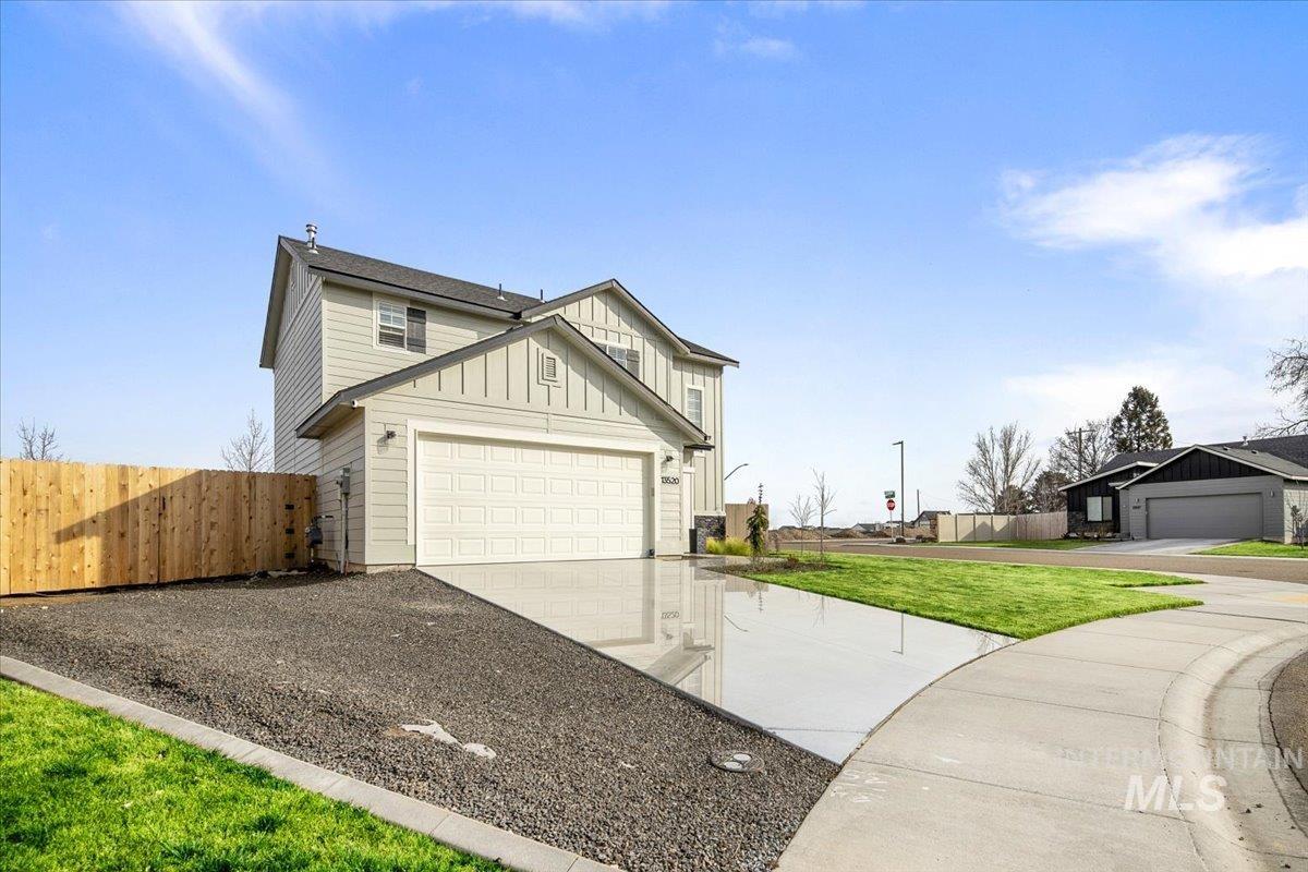 13520 Farwell Street Caldwell, ID 83607 - Photo 4 of 26 View of front of home featuring board and batten siding and driveway