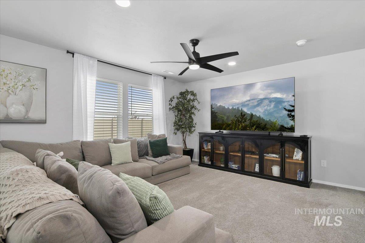 13520 Farwell Street Caldwell, ID 83607 - Photo 6 of 26 Carpeted living room with a ceiling fan and recessed lighting