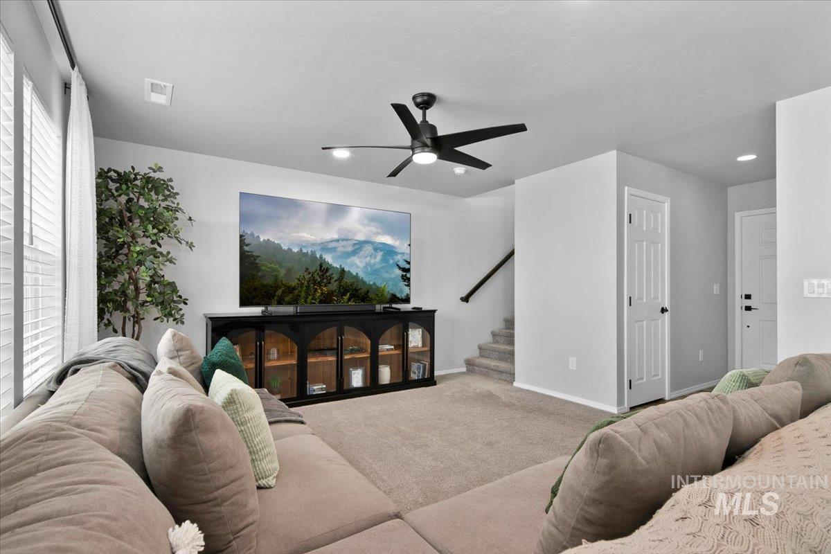 13520 Farwell Street Caldwell, ID 83607 - Photo 8 of 26 Living room with carpet floors and a ceiling fan