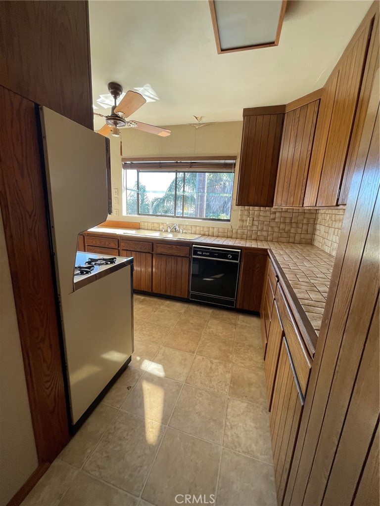 2004 Ripley Avenue Redondo Beach, CA 90278 - Photo 17 of 18 a kitchen with stainless steel appliances granite countertop a refrigerator a sink a stove and dishwasher