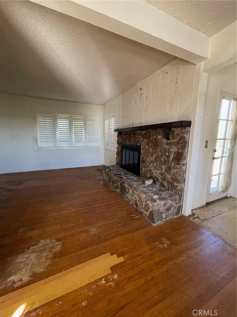 2004 Ripley Avenue Redondo Beach, CA 90278 - Photo 9 of 18 an empty room with a fireplace and a window