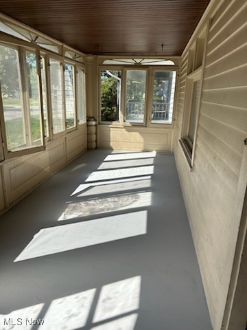 11509 Granger Road Cleveland, OH 44125 - Photo 3 of 16 Unfurnished sunroom with finished concrete flooring and wooden ceiling