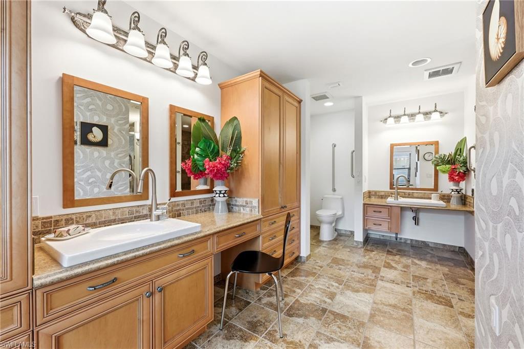2274 Queens Way Naples, FL 34112 - Photo 16 of 28 a spacious bathroom with a sink double vanity granite and a mirror