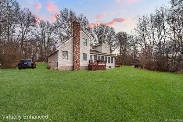 a view of a yard with a house in the background