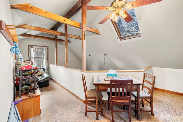 a bedroom with a bed and lamp