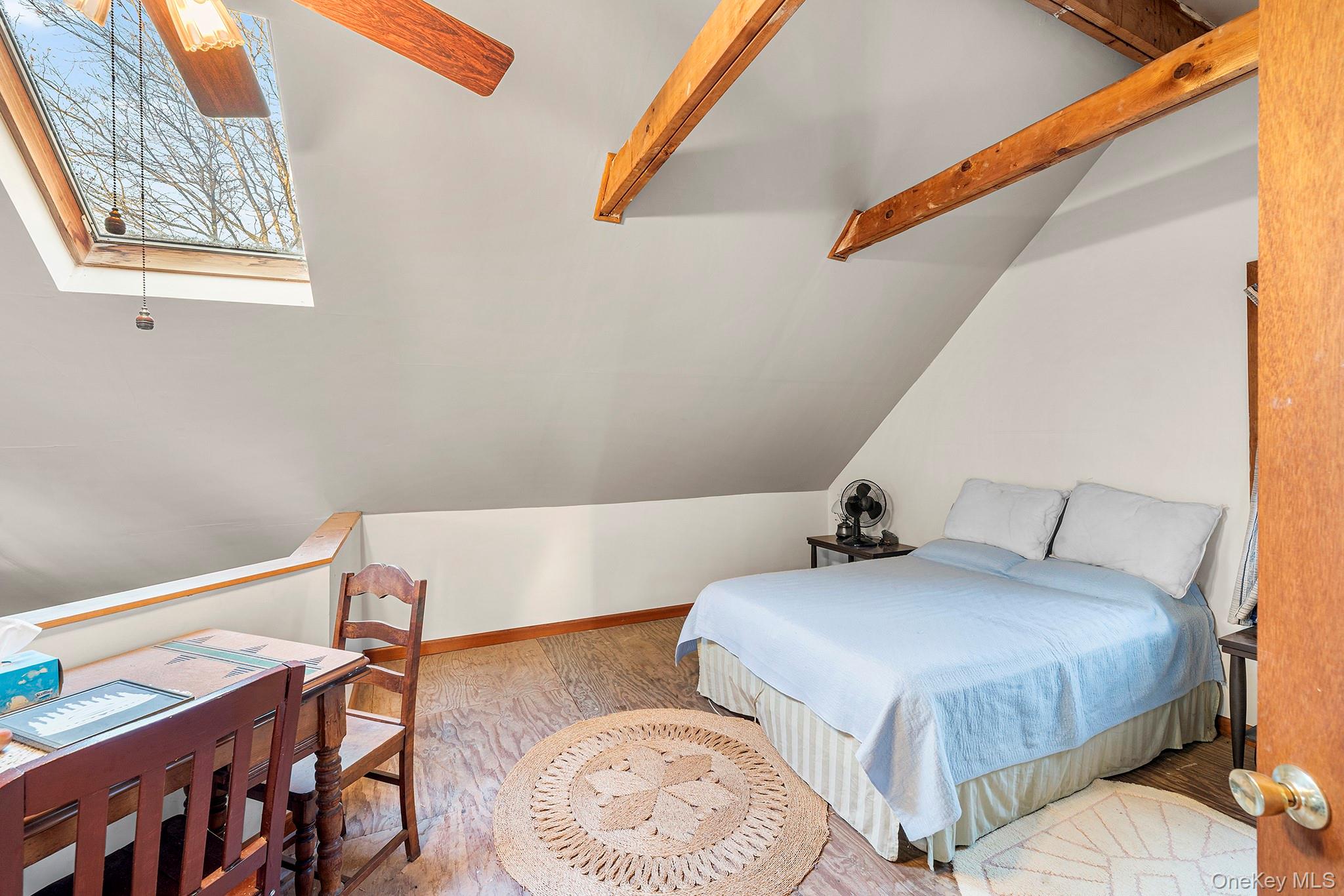 290 Ridge Road Campbell Hall, NY 10916 - Photo 18 of 26 a bedroom with a bed and lamp