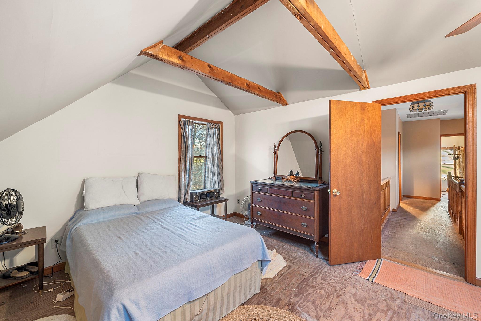 290 Ridge Road Campbell Hall, NY 10916 - Photo 19 of 26 a bedroom with a bed and a dresser next to a window