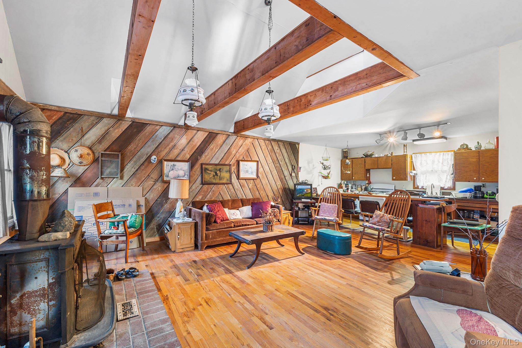 290 Ridge Road Campbell Hall, NY 10916 - Photo 2 of 26 a living room with lots of furniture and wide windows