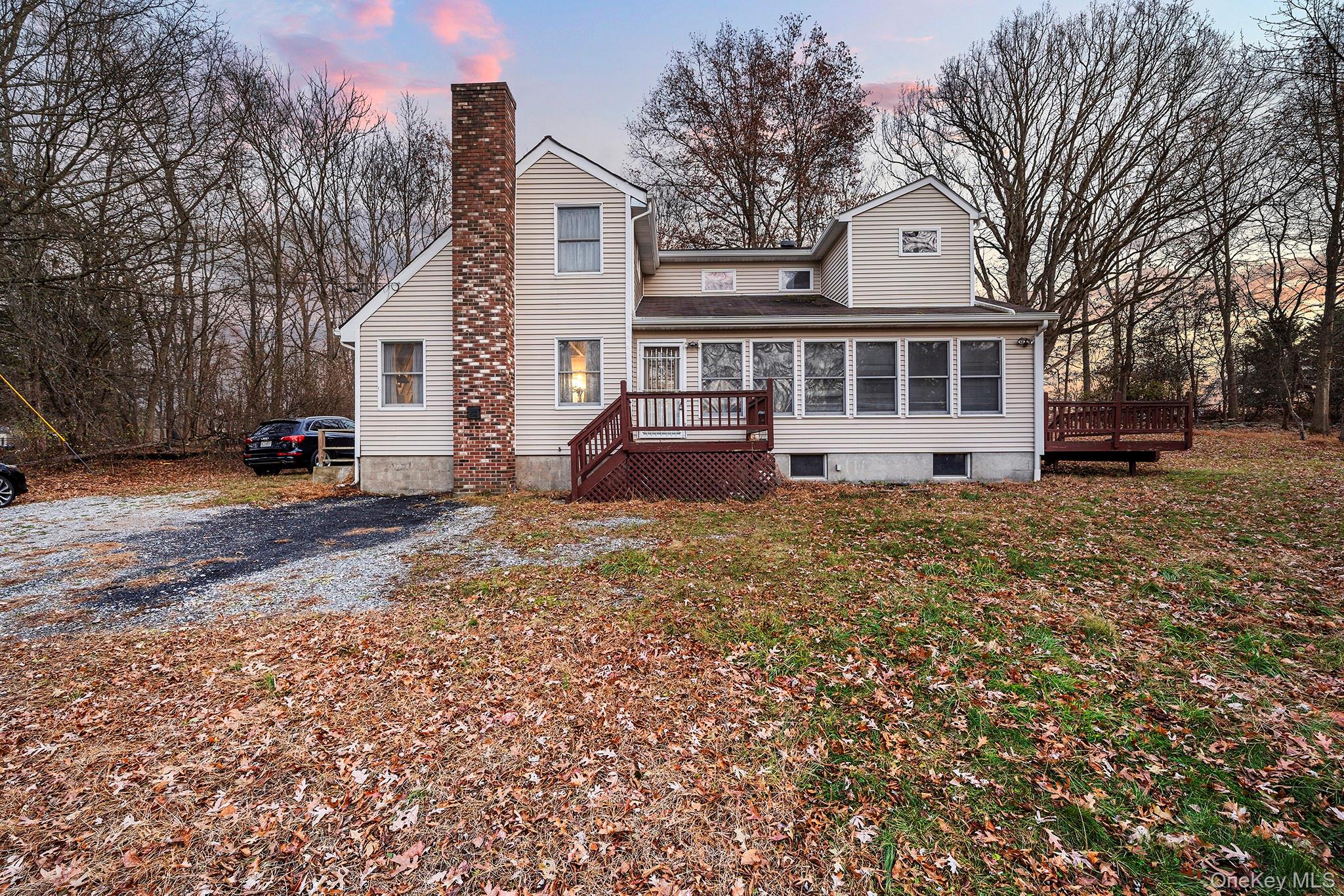 290 Ridge Road Campbell Hall, NY 10916 - Photo 22 of 26 a view of a house with a yard covered in snow