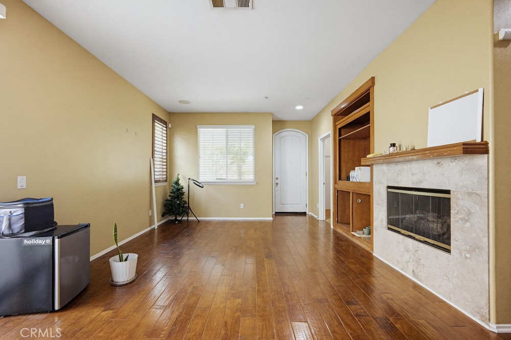 1747 Palermo Drive Riverside, CA 92507 - Photo 7 of 30 a view of an empty room with window and wooden floor