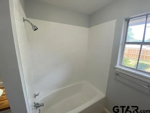 a bathroom with a bathtub