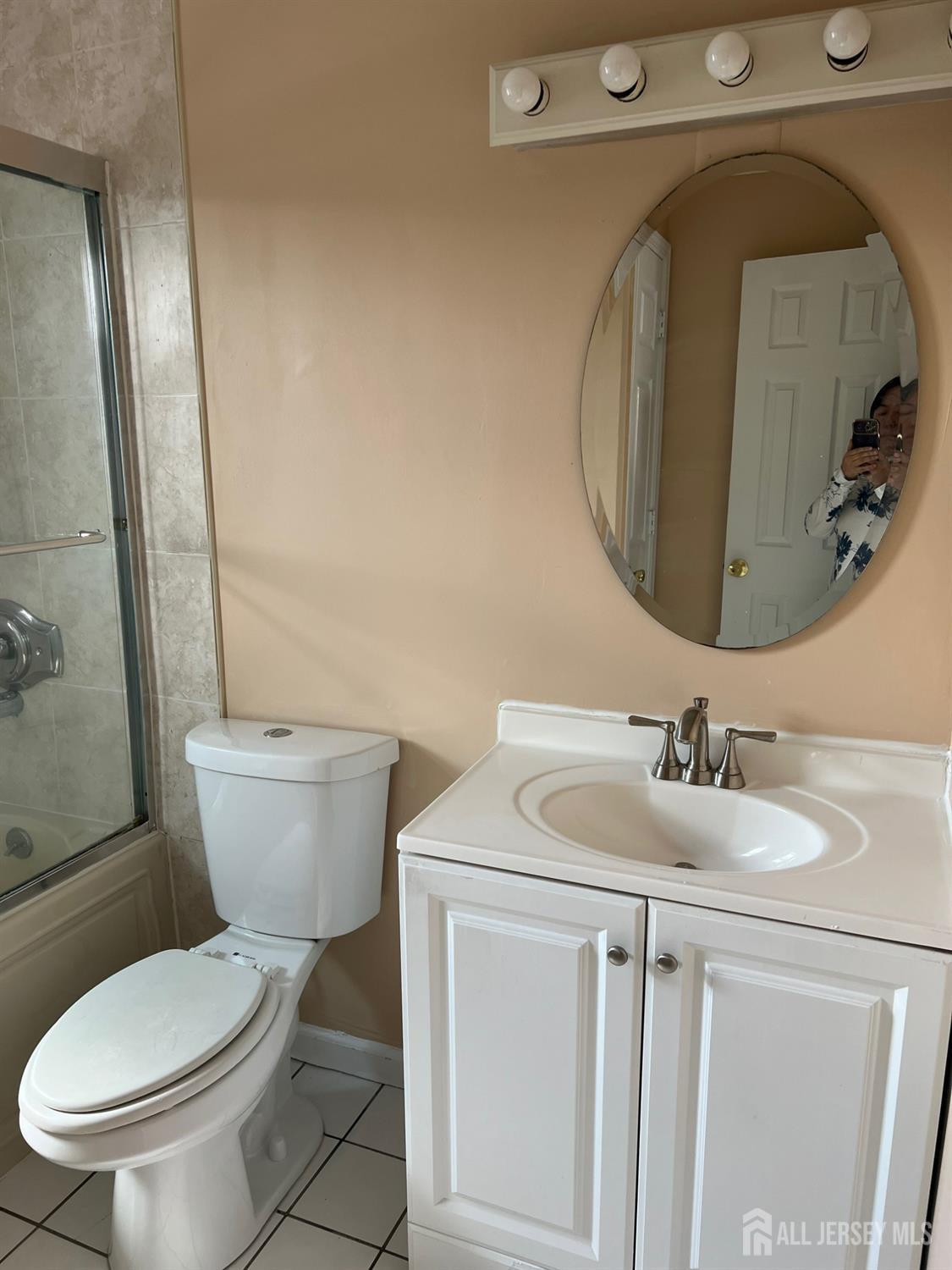 19A Gramercy Gardens Place Middlesex, NJ 08846 - Photo 8 of 8 a bathroom with a toilet sink and mirror