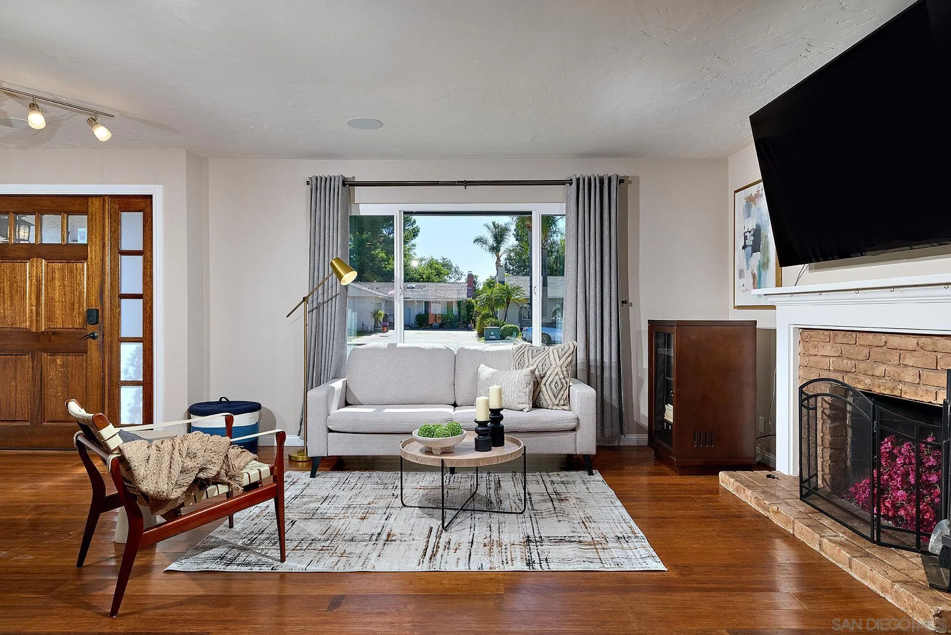 12835 Reo Real Drive Poway, CA 92064 - Photo 1 of 46 a living room with fireplace furniture and a flat screen tv