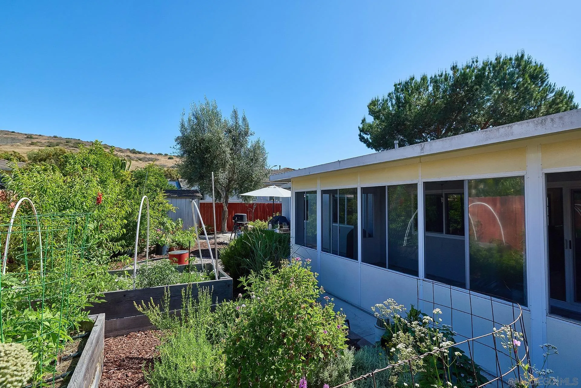 12835 Reo Real Drive Poway, CA 92064 - Photo 20 of 46 a view of a house with potted plants