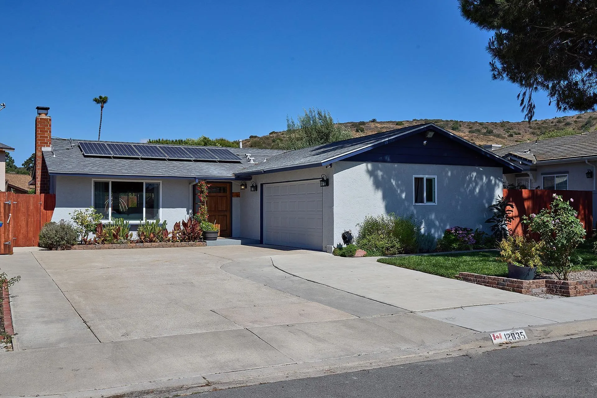 12835 Reo Real Drive Poway, CA 92064 - Photo 2 of 46 a front view of a house with garden