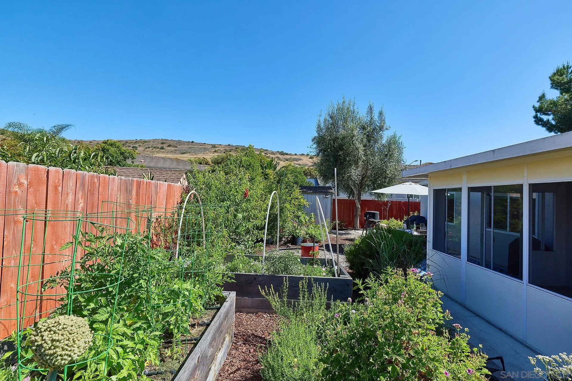 12835 Reo Real Drive Poway, CA 92064 - Photo 21 of 46 front view of a house with a yard