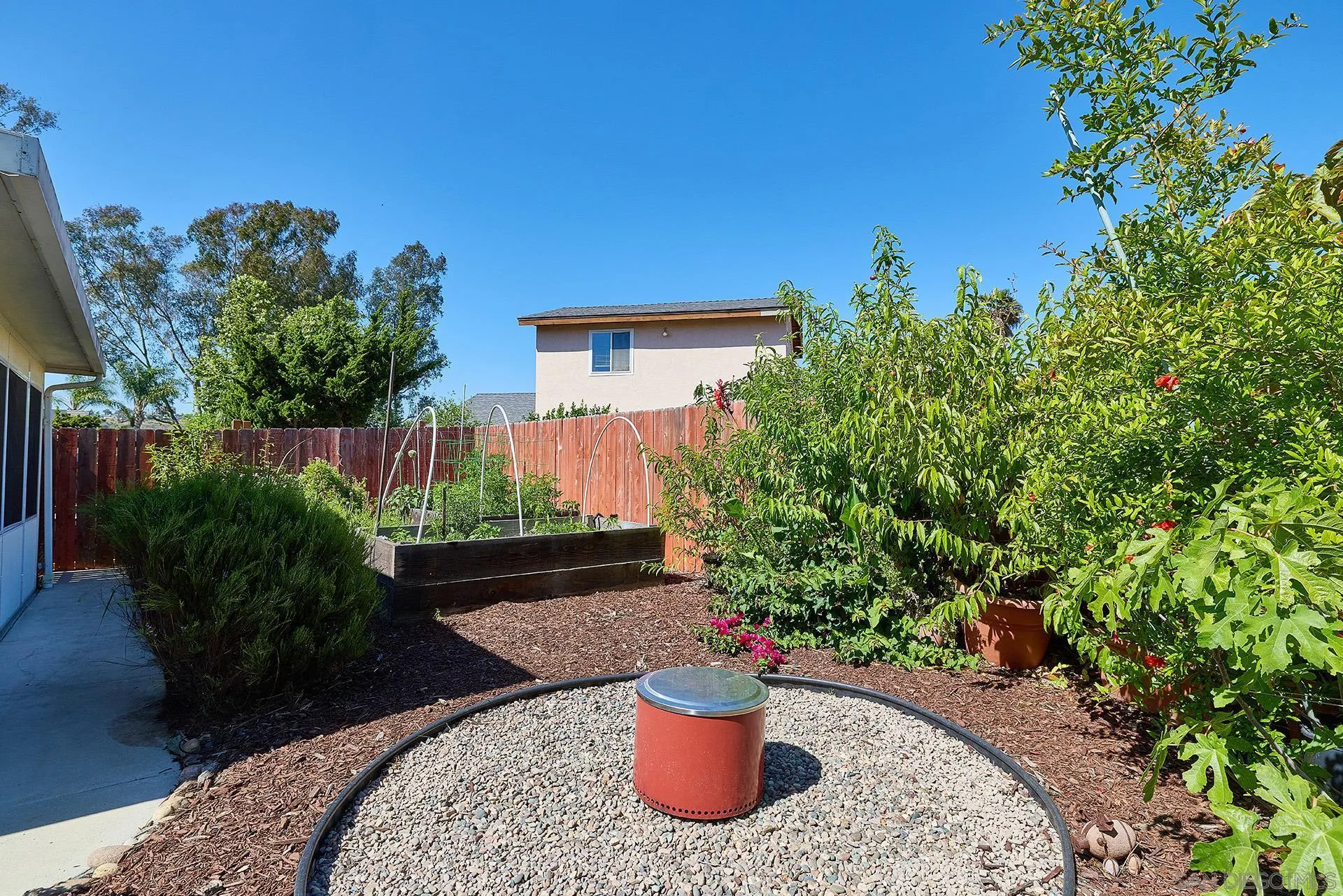 12835 Reo Real Drive Poway, CA 92064 - Photo 22 of 46 a view of a balcony with chair and potted plants