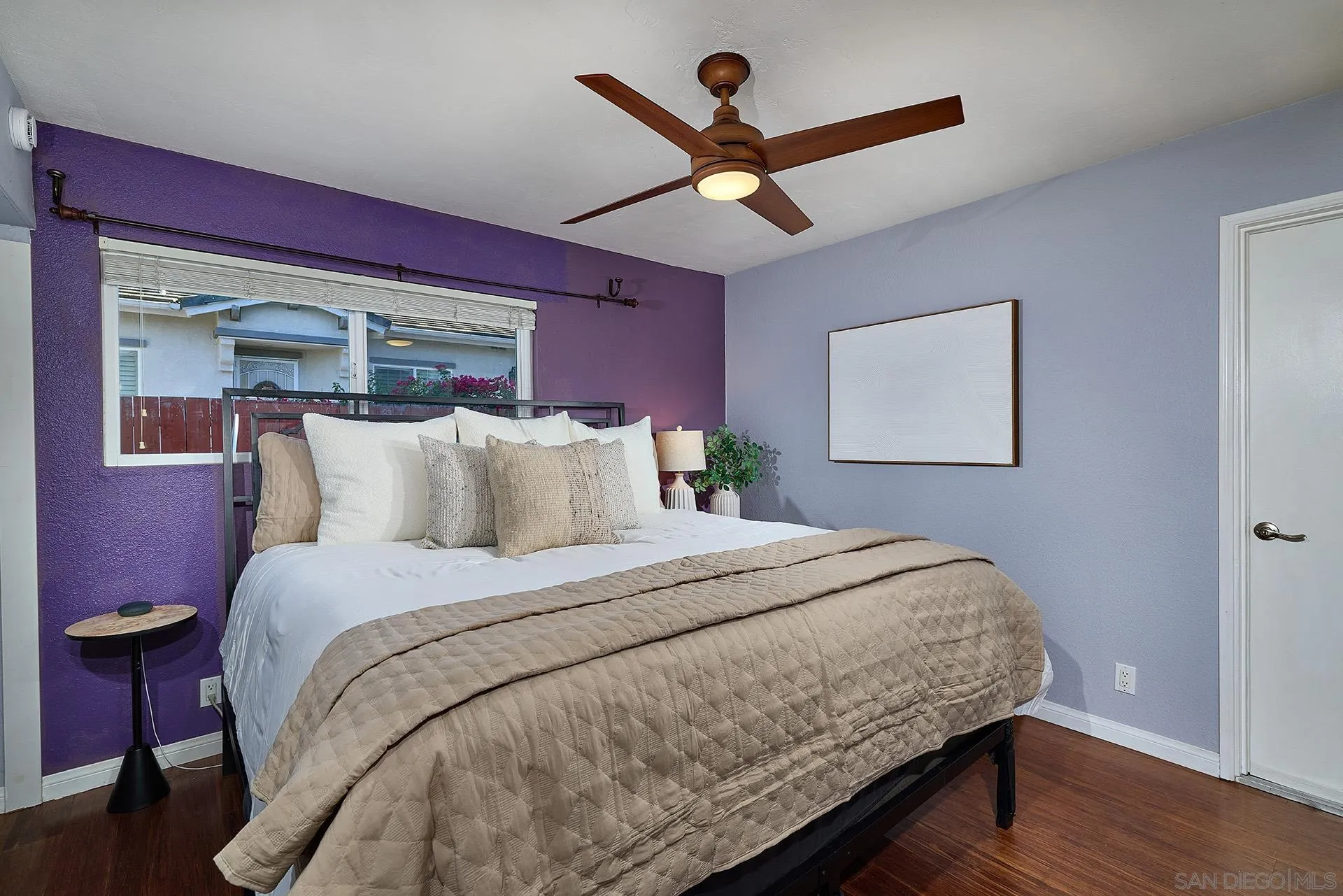 12835 Reo Real Drive Poway, CA 92064 - Photo 26 of 46 a bedroom with a bed and a chandelier