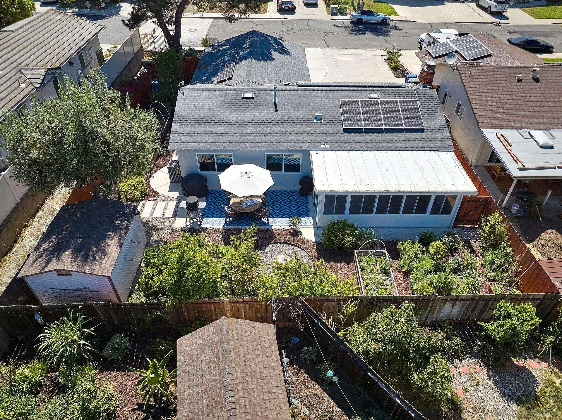 12835 Reo Real Drive Poway, CA 92064 - Photo 3 of 46 a view of a patio with table and chairs and potted plants