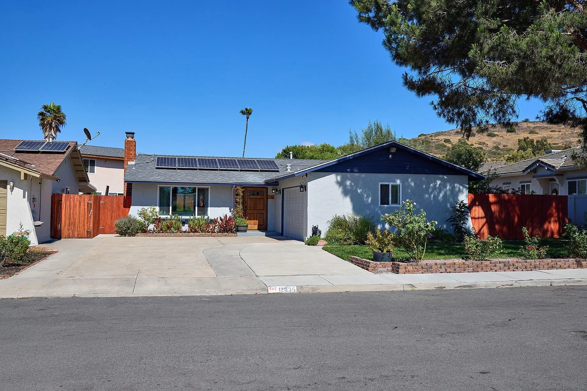 12835 Reo Real Drive Poway, CA 92064 - Photo 4 of 46 a front view of a house with garden