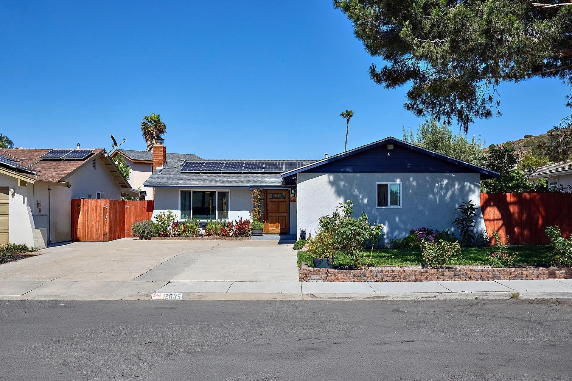 12835 Reo Real Drive Poway, CA 92064 - Photo 5 of 46 a front view of a house with a yard