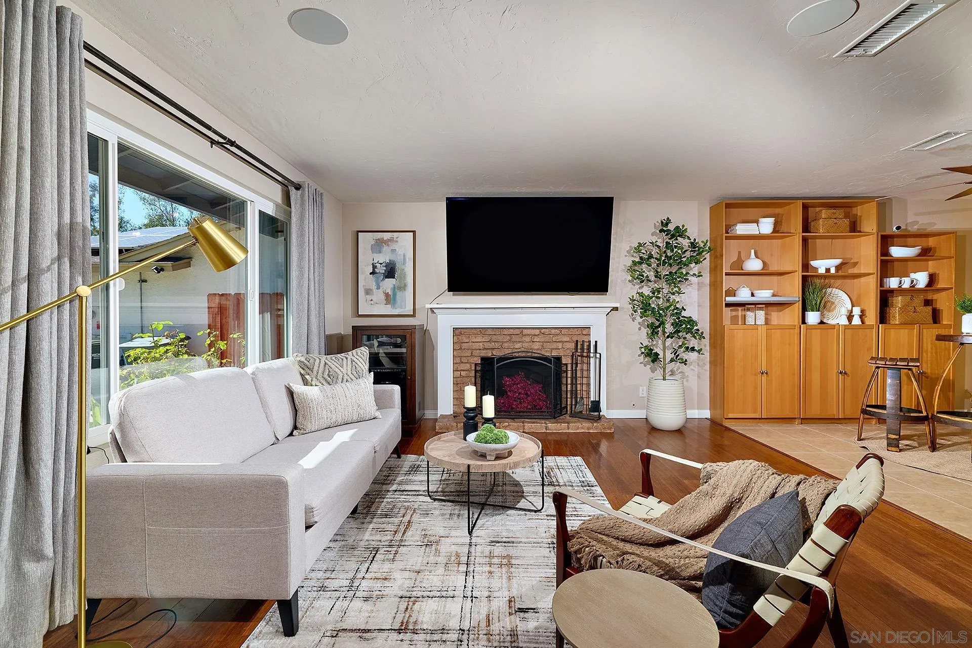 12835 Reo Real Drive Poway, CA 92064 - Photo 6 of 46 a living room with furniture fireplace and a large window