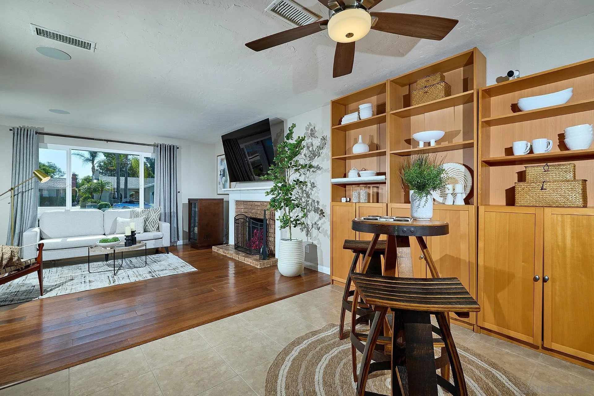 12835 Reo Real Drive Poway, CA 92064 - Photo 9 of 46 a living room with furniture a fireplace and a flat screen tv