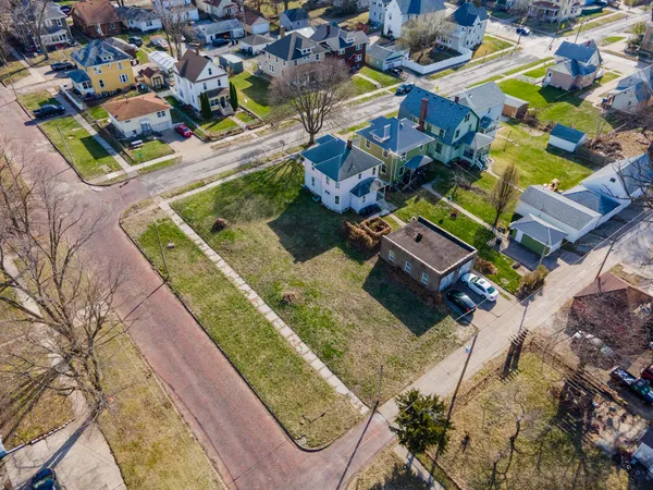 an aerial view of a house with a garden