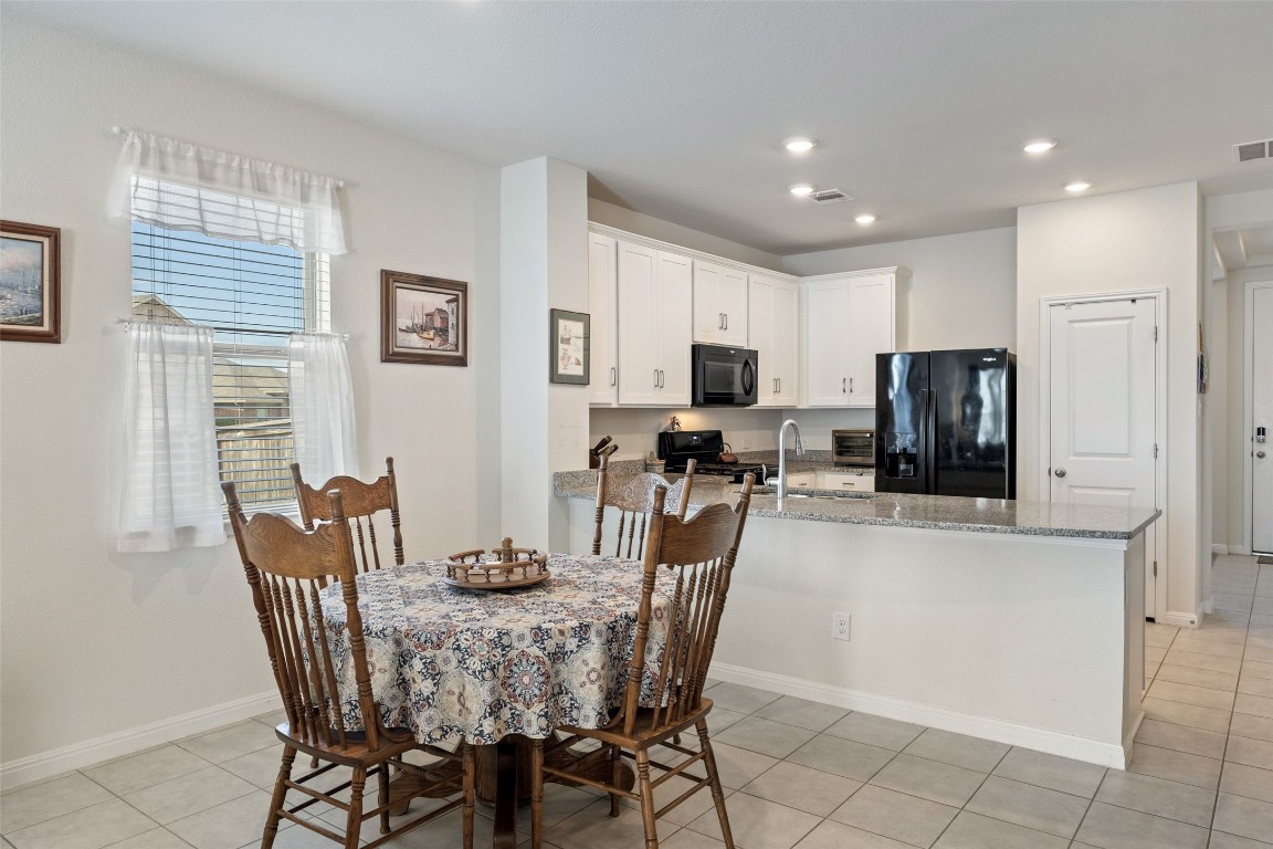 11701 Pecangate Way Manor, TX 78653 - Photo 12 of 40 a view of a dining room with furniture