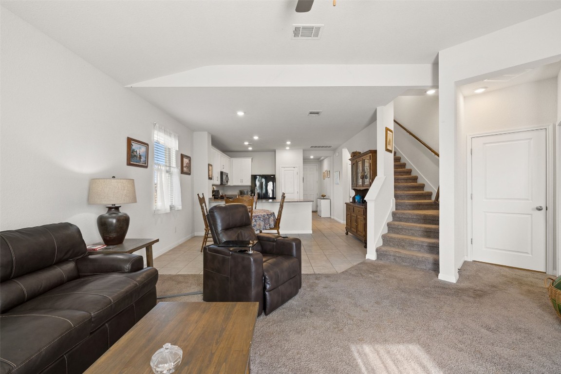 11701 Pecangate Way Manor, TX 78653 - Photo 13 of 40 a living room with furniture and a wooden floor