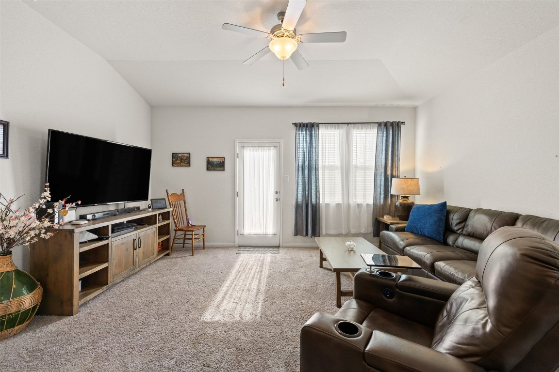 11701 Pecangate Way Manor, TX 78653 - Photo 14 of 40 a living room with furniture and a flat screen tv