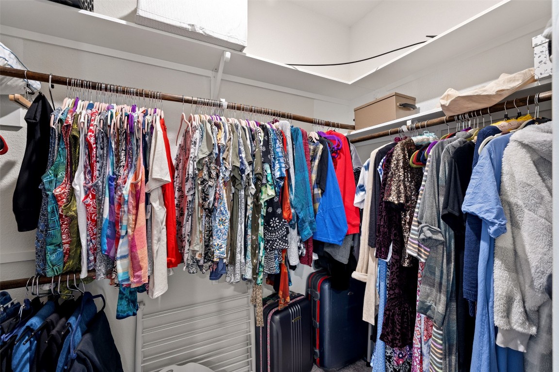 11701 Pecangate Way Manor, TX 78653 - Photo 20 of 40 a view of walk in closet with clothes