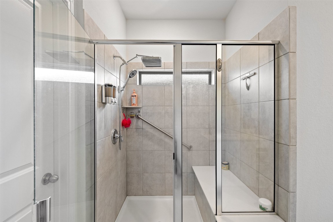 11701 Pecangate Way Manor, TX 78653 - Photo 22 of 40 a bathroom with a shower and a sink