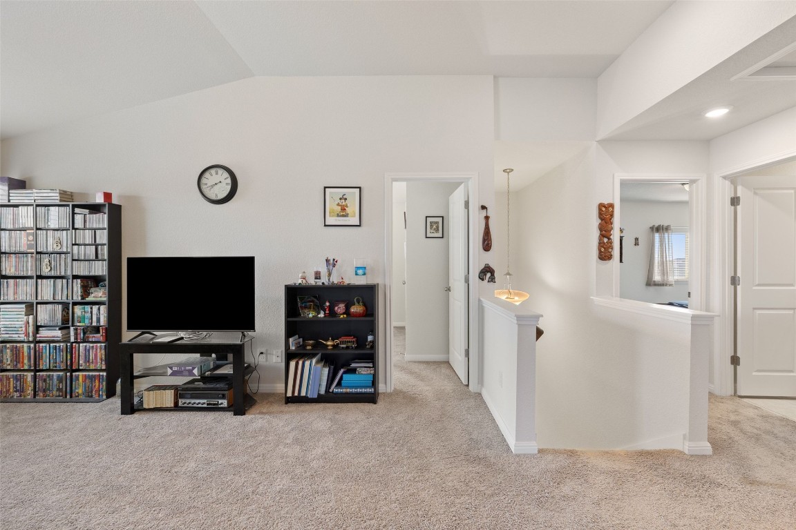 11701 Pecangate Way Manor, TX 78653 - Photo 25 of 40 a view of a livingroom with furniture and a flat screen tv