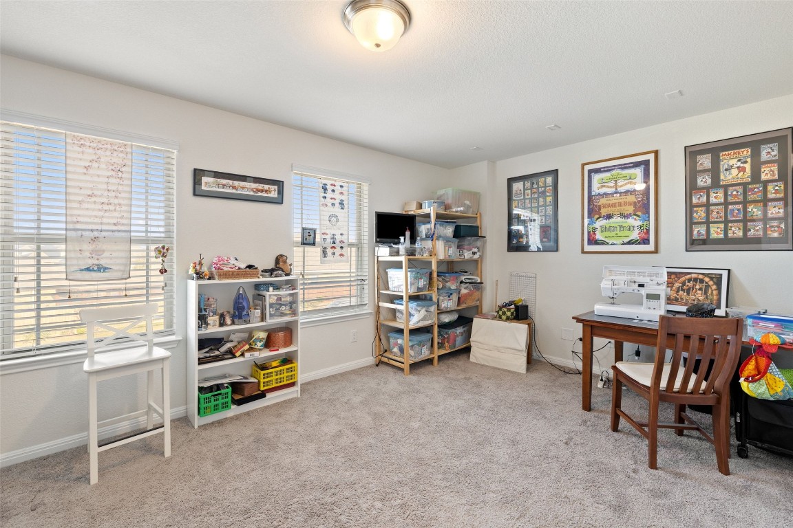11701 Pecangate Way Manor, TX 78653 - Photo 26 of 40 a view of a workspace with furniture and toys