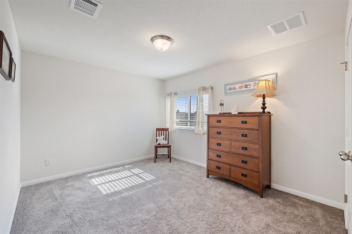 11701 Pecangate Way Manor, TX 78653 - Photo 28 of 40 a view of room with cabinet